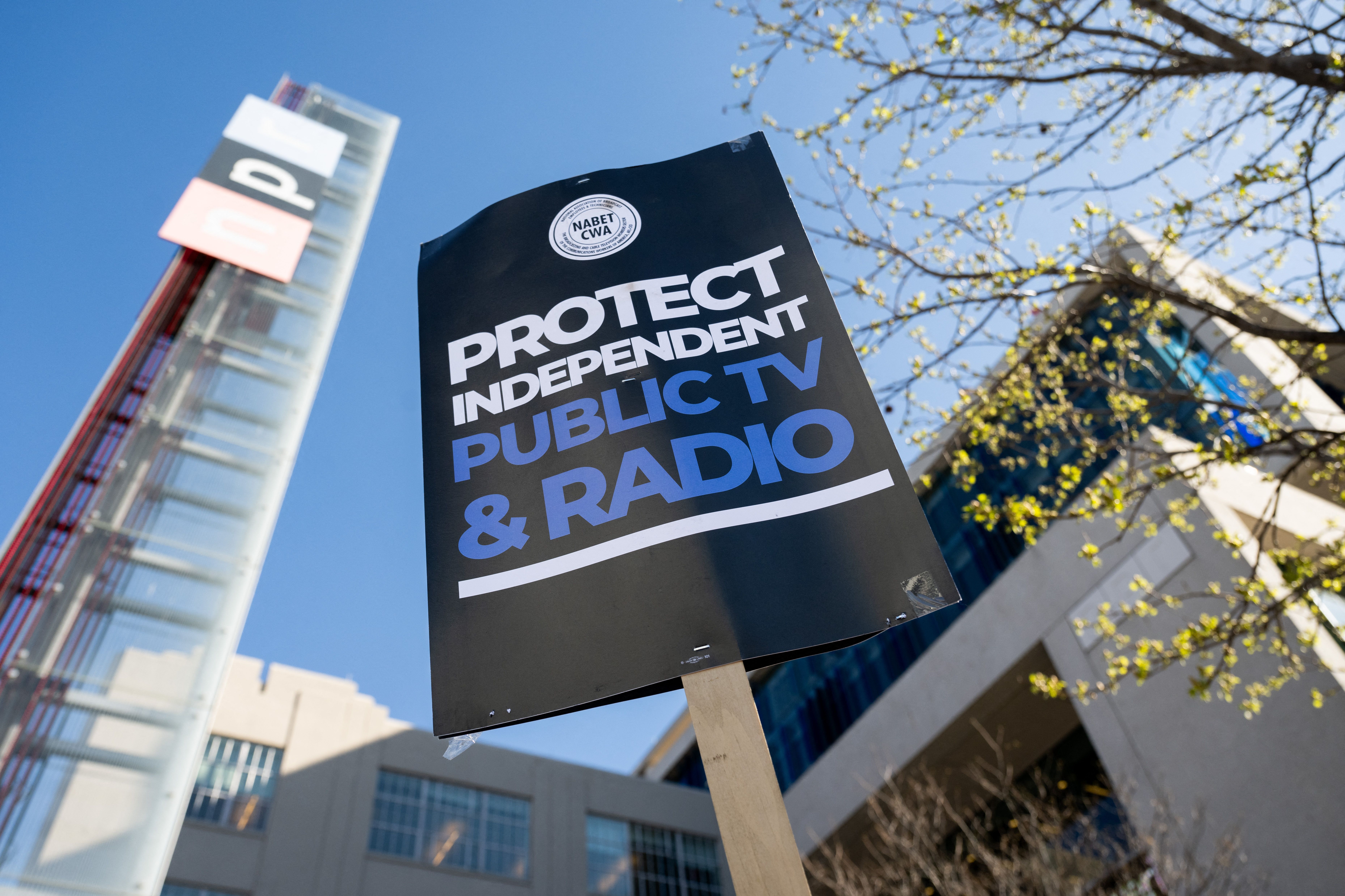 A sign to support American public media during a rally outside the NPR headquarters in March 2025 (Photo: Saul Loeb/AFP)