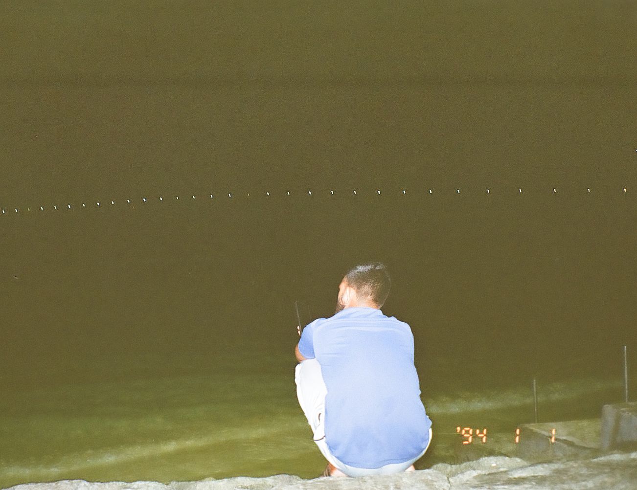 A man came to the artificial beach, talking on the phone. (Photo: Peerachai Pasutan)